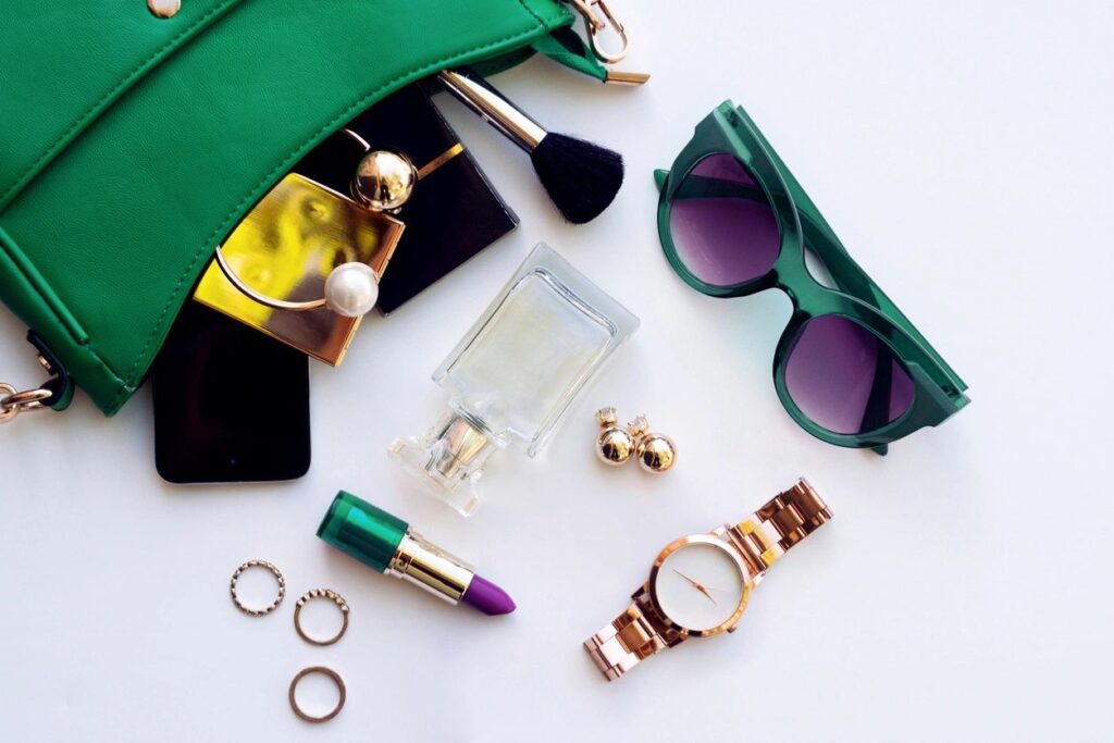 A table with some green sunglasses and other items