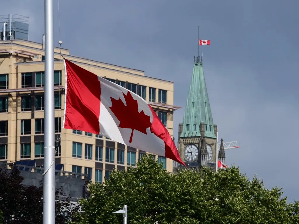 The flag of Canada waving on a pole