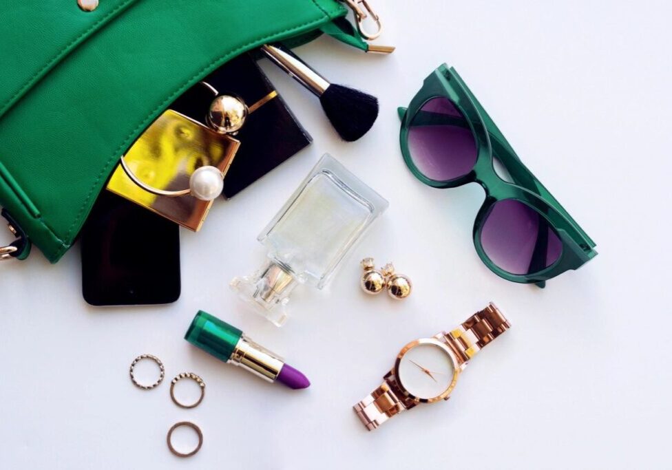 A table with some green sunglasses and other items